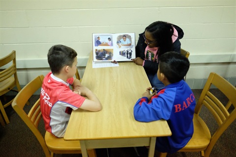 Volunteers read to students at El Sol Elementary School